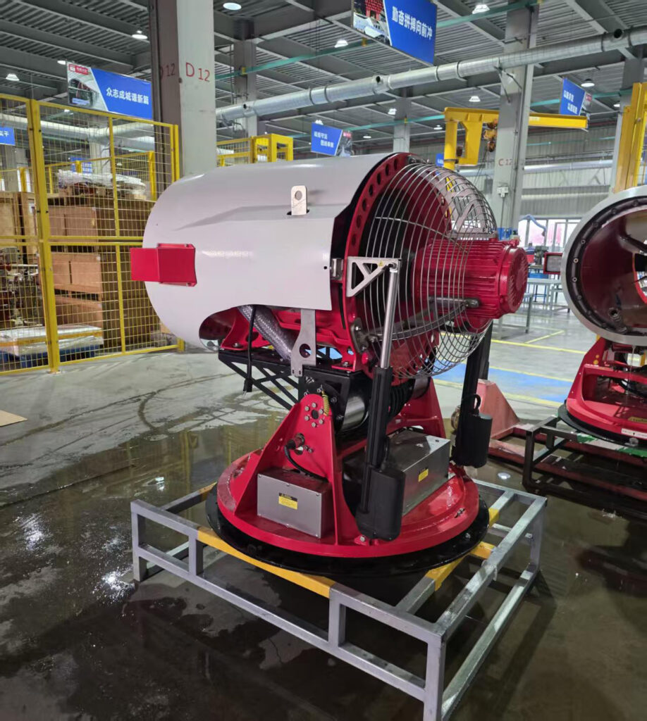 Rear three-quarter view of a water mist turbine showing the fan guard, red motor, positioning base and steel support frame